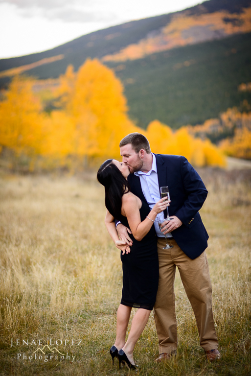 engaged couple kiss in Aspen grove for colorado engagement photo